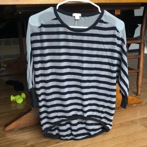 3/4 length shirt. Higher in front &longer in back.